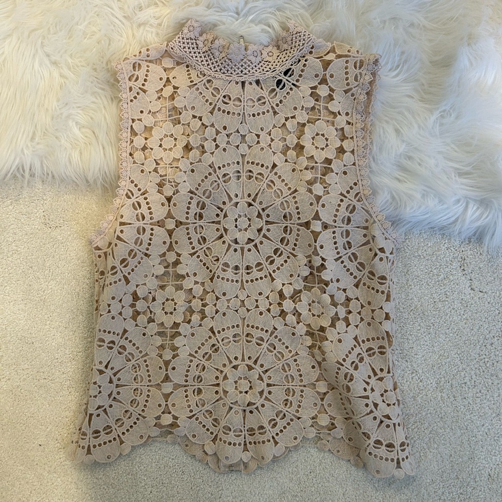 Crochet style high neck top in peach. Featuring a zipper in the back
Side S
